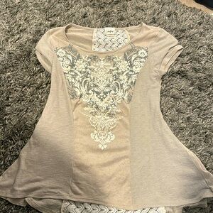 cream/tan shirt with pattern (from the buckle)